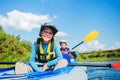 Happy boy kayaking on the river on a sunny day during summer vacation Royalty Free Stock Photo