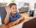 Happy boy, laptop and waving in video call for elearning, education or virtual classroom introduction at home. Face of Royalty Free Stock Photo