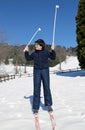 Happy boy learns to ski cross-country in winter Royalty Free Stock Photo