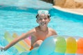 Happy boy on lilo in pool Royalty Free Stock Photo