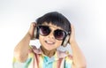 Happy boy is listening to music on headphone isolated Royalty Free Stock Photo