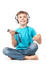 Happy boy listens music with smartphone Royalty Free Stock Photo