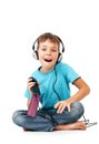 Happy boy listens music with smartphone Royalty Free Stock Photo