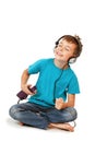 Happy boy listens music with smartphone Royalty Free Stock Photo