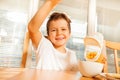 Happy boy making breakfast in the kitchen Royalty Free Stock Photo
