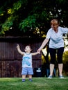 Happy boy making funny faces and expressions while walking with his grandmother Royalty Free Stock Photo