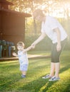 Happy boy making funny faces and expressions while walking with his grandmother Royalty Free Stock Photo