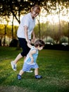 Happy boy making funny faces and expressions while walking with his grandmother Royalty Free Stock Photo