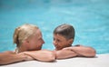 Happy boy and mom in swimming pool Royalty Free Stock Photo