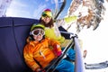 Happy boy with mother on ski chair lift Royalty Free Stock Photo