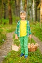 Happy boy picking mushrooms in the forest Royalty Free Stock Photo