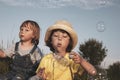 Happy Boy play in bubbles in field sunny summer day Royalty Free Stock Photo