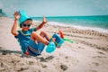 Happy boy play with toys on beach, child on vacation at sea Royalty Free Stock Photo