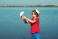 Boy playing outdoors with paper airplanes Royalty Free Stock Photo