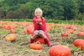 Happy boy playing on pumpkin field Royalty Free Stock Photo