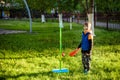 Happy boy is playing tetherball swing ball game in summer camping. Happy leisure healthy active time outdoors concept