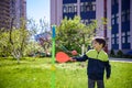 Happy boy is playing tetherball swing ball game in summer camping. Happy leisure healthy active time outdoors concept