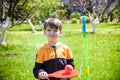 Happy boy is playing tetherball swing ball game in summer camping. Happy leisure healthy active time outdoors concept