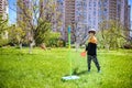 Happy boy is playing tetherball swing ball game in summer camping. Happy leisure healthy active time outdoors concept