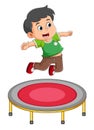 The happy boy is playing the trampoline and jumping very high Royalty Free Stock Photo