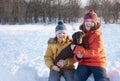 Happy boy playing with white dog in winter day, dog and child on Royalty Free Stock Photo