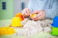 Happy boy plays kinetic sand at home Royalty Free Stock Photo