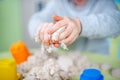 Happy boy plays kinetic sand at home Royalty Free Stock Photo