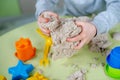 Happy boy plays kinetic sand at home Royalty Free Stock Photo