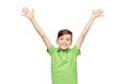 Happy boy in polo t-shirt raising hands up