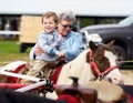 Happy Boy on a Pony Ride Royalty Free Stock Photo