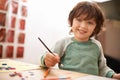 Happy boy, portrait and drawing with color for creativity, learning or education at home. Young child with smile and Royalty Free Stock Photo