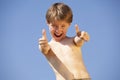 Happy boy posing thumbs up Royalty Free Stock Photo