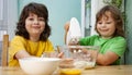 Happy boy preparing the dough, bake cookies in the kitchen. family funny