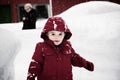 Happy Boy in a Red Jacket on a Snowy Day Royalty Free Stock Photo