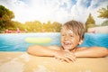 Happy boy relaxing at the swimming pool edge Royalty Free Stock Photo