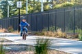 Happy boy riding his bicycle on bike lane Royalty Free Stock Photo