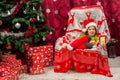 Happy boy with Santa hat sitting in chair Royalty Free Stock Photo