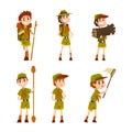 Happy Boy Scouts Wearing Khaki Uniform Carrying Brushwood, Backpacking, Catching Butterflies with Net and Standing with