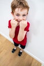 Happy boy showing his defense with threatening fists protecting face Royalty Free Stock Photo