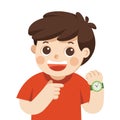 Happy boy showing wrist watch. Shows a time. Little boy pointing at his wrist watch posing Royalty Free Stock Photo