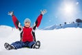 Happy boy sitting on sled on sunny day Royalty Free Stock Photo