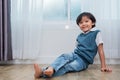 Happy boy sitting and smiling in bedroom. Lifestyles and people concept. Portrait and Happiness life concept. Home sweet home