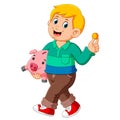 Happy a boy smiling and carrying pig bank Royalty Free Stock Photo