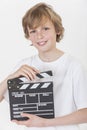 Happy Boy Smiling With Clapperboard