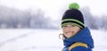 Happy boy in snow play and smile sunny day outdoors Royalty Free Stock Photo