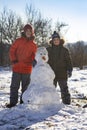 Happy boy in snow play and smile sunny day outdoors Royalty Free Stock Photo