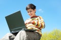 Happy boy studies outside Royalty Free Stock Photo