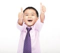 Happy Boy in a suit and showing thumbs up isolated on white background Royalty Free Stock Photo