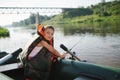 Happy boy swimming in fishing boat Royalty Free Stock Photo