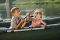 Happy boy swimming in fishing boat Royalty Free Stock Photo